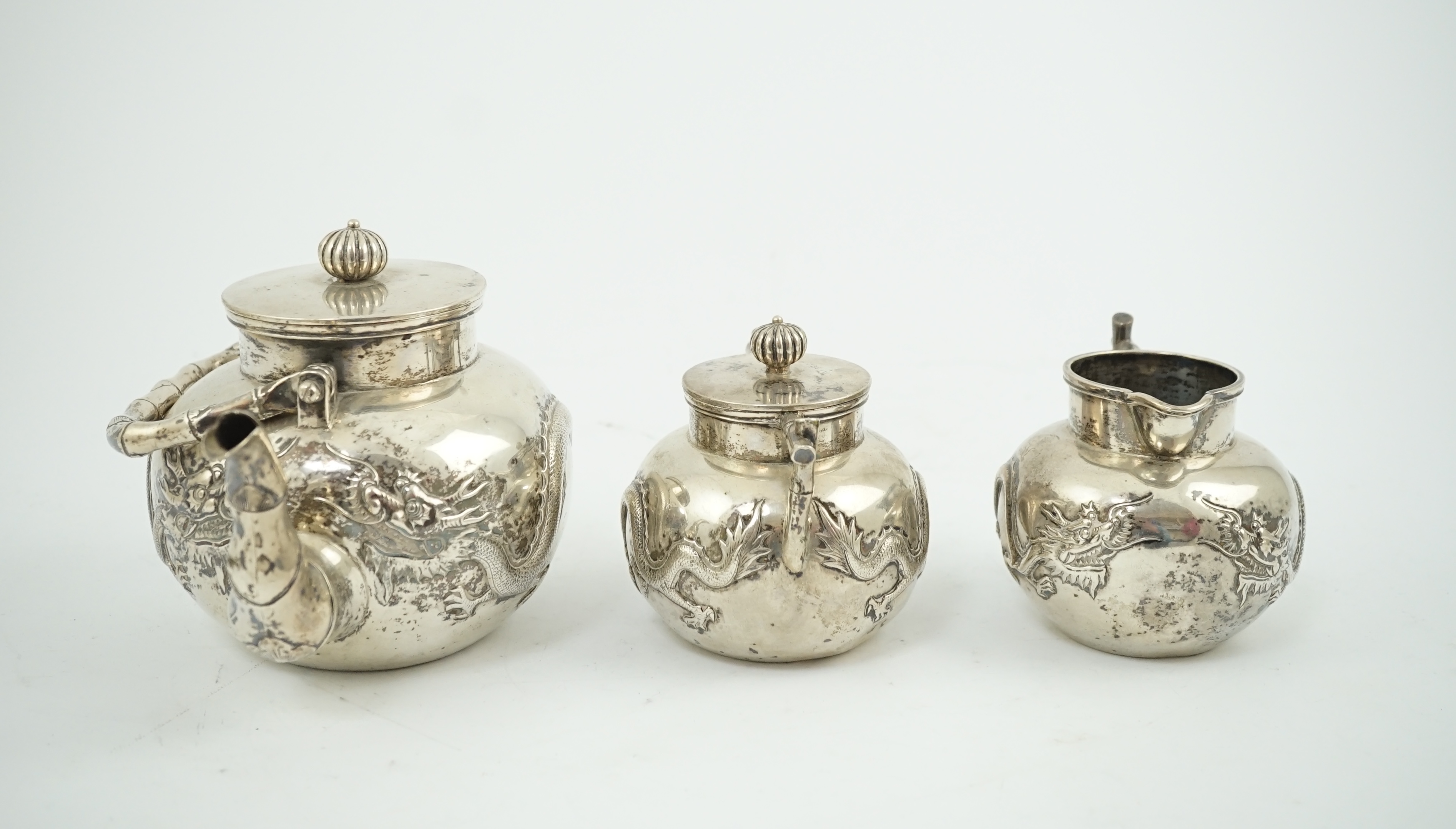 A late 19th/early 20th century Chinese Export silver three piece tea set, by Luen Wo, Shanghai